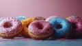 Assorted colorful doughnuts on a pink background Royalty Free Stock Photo