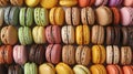 Assorted colorful macarons arranged in rows