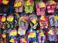 Assorted colorful rubber slippers on sale at a store