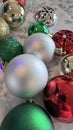 Assorted colorful sparkly christmas balls & bells