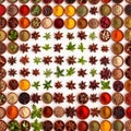 Assorted colorful spices and herbs, cookin ingredients in organized grid row, white background