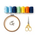 Assorted colorful thread spools with embroidery hoop and gold scissors Royalty Free Stock Photo