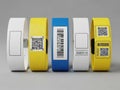 Assorted colorful wristbands with barcodes and qr codes isolated on white background Royalty Free Stock Photo