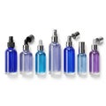 Assorted colors of empty plastic spray bottles arranged in a row Royalty Free Stock Photo