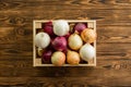 Assorted colors of fresh whole onions