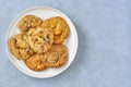 Assorted cookies with dark and white chocolate in a plate. Top view Royalty Free Stock Photo