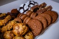 Assorted cookies with macarons, chocolate cookies, cocoa balls and fruity cookies
