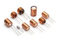 Assorted copper-colored electronic inductors and coils on white background Royalty Free Stock Photo
