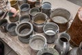 Assorted copperware and rugs on flea market Royalty Free Stock Photo