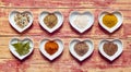Assorted culinary spices in heart shaped dishes Royalty Free Stock Photo