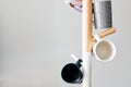 Cups hanging on a coat rack with copy space Royalty Free Stock Photo