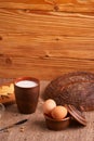 Assorted dairy products milk, cheese, eggs. rustic still life on table Royalty Free Stock Photo