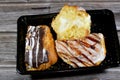 Assorted Danish pastry with brown dark chocolate, white chocolate, caramel sauce and pastry cream, sweet bakery dough baked in the