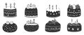 Assorted decorative cakes with candles on white background in black and white Royalty Free Stock Photo