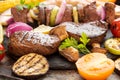 Assorted delicious grilled barbecue meat with vegetable. Beef gr Royalty Free Stock Photo