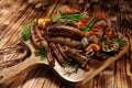 Assorted delicious grilled meat with vegetable on a barbecue. Grilled pork shish or kebab on skewers with vegetables . Food Royalty Free Stock Photo