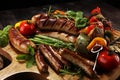 Assorted delicious grilled meat with vegetable on a barbecue. Grilled pork shish or kebab on skewers with vegetables . Food Royalty Free Stock Photo