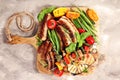 Assorted delicious grilled meat with vegetable on a barbecue. Grilled pork shish or kebab on skewers with vegetables . Food Royalty Free Stock Photo