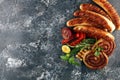 Assorted delicious grilled meat with vegetable on a barbecue with grilled sausages and vegetables on table Royalty Free Stock Photo