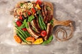 Assorted delicious grilled meat with vegetable on a barbecue. Grilled pork shish or kebab on skewers with vegetables . Food