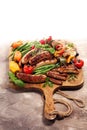 Assorted delicious grilled meat with vegetable on a barbecue. Grilled pork shish or kebab on skewers with vegetables . Food Royalty Free Stock Photo