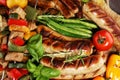 Assorted delicious grilled meat with vegetable on a barbecue. Grilled pork shish or kebab on skewers with vegetables . Food