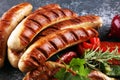 Assorted delicious grilled meat with vegetable on a barbecue with grilled sausages and vegetables on table Royalty Free Stock Photo