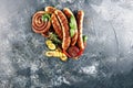 Assorted delicious grilled meat with vegetable on a barbecue with grilled sausages and vegetables on table Royalty Free Stock Photo