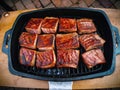 Assorted delicious grilled meat with vegetable over the coals on a barbecue