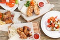 Assorted delicious grilled meat with vegetable over the coals on a barbecue Royalty Free Stock Photo