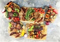 Assorted delicious grilled meat with vegetable on rustic table Royalty Free Stock Photo