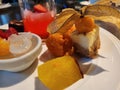 Assorted Dessert Plate With Fruit, Cake, and Refreshing Drink in Elegant Dining Setting Presentation Today Royalty Free Stock Photo