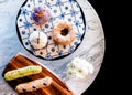 Assorted dessert on white mable table, donut, cup cake, eclaire