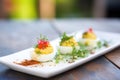 assorted deviled eggs with different spice levels