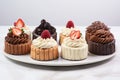Assorted cakes with cream, chocolate and berries dessert assorted variety of different decorated cakes Royalty Free Stock Photo