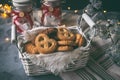 Assorted different types of homemade cookies in white wicker basket on dark background Royalty Free Stock Photo