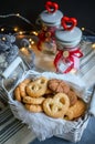 Assorted different types of homemade cookies in white wicker basket on dark background Royalty Free Stock Photo