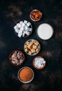 Assorted different types of sugar in bowls on a table on a dark background, vertical image Royalty Free Stock Photo