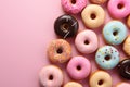 Assorted donuts in a minimalistic top view pattern on brown Royalty Free Stock Photo