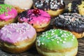 Assorted doughnuts in the glaze and colorful sprinkles Royalty Free Stock Photo