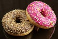 Assorted doughnuts in the glaze and colorful sprinkles Royalty Free Stock Photo