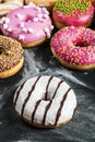 Assorted doughnuts in the glaze and colorful sprinkles Royalty Free Stock Photo