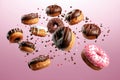 Assorted doughnuts with sprinkles on pink background Royalty Free Stock Photo