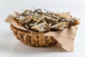 Assorted dried fish in a basket on craft paper Royalty Free Stock Photo