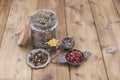 Assorted dried flowers and tea on a wooden background. Natural health. Aromatherapy. Free space for text. Copy space. Royalty Free Stock Photo