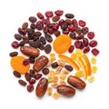 Assorted dried fruits and nuts arranged in a circular pattern on a white background Royalty Free Stock Photo