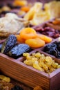 Assorted dried fruits in wooden box Royalty Free Stock Photo
