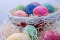 Assorted easter eggs in a wicker basket