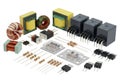 Assorted electronic components including inductors, transformers, relays, and capacitors Royalty Free Stock Photo
