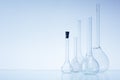 Assorted empty laboratory glassware, test-tubes. Blue tone medical background. Copy space Royalty Free Stock Photo